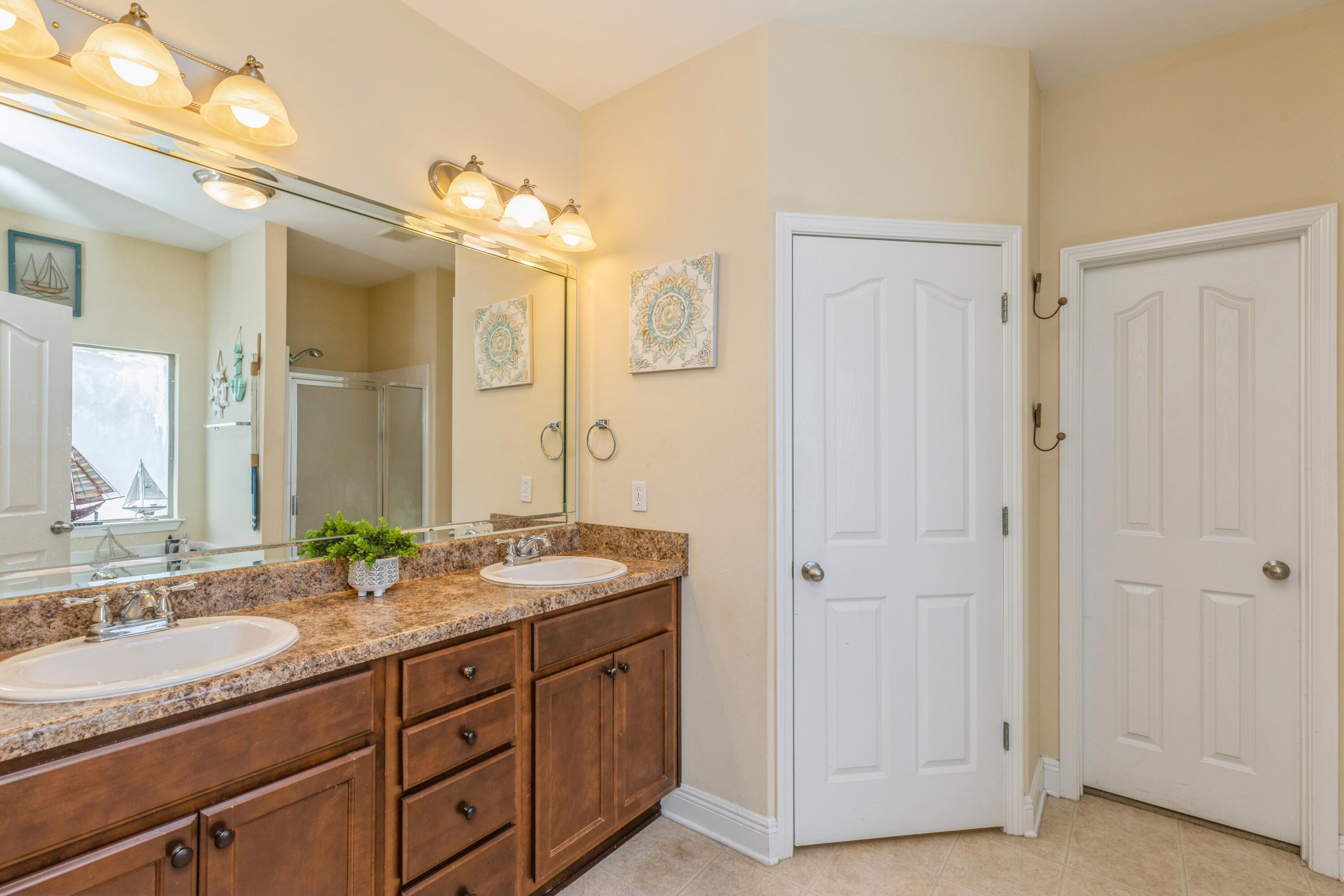 609 Rowan Circle Crestview, FL 32536 - Photo 30 of 37 a bathroom with a granite countertop double vanity sink mirror and
