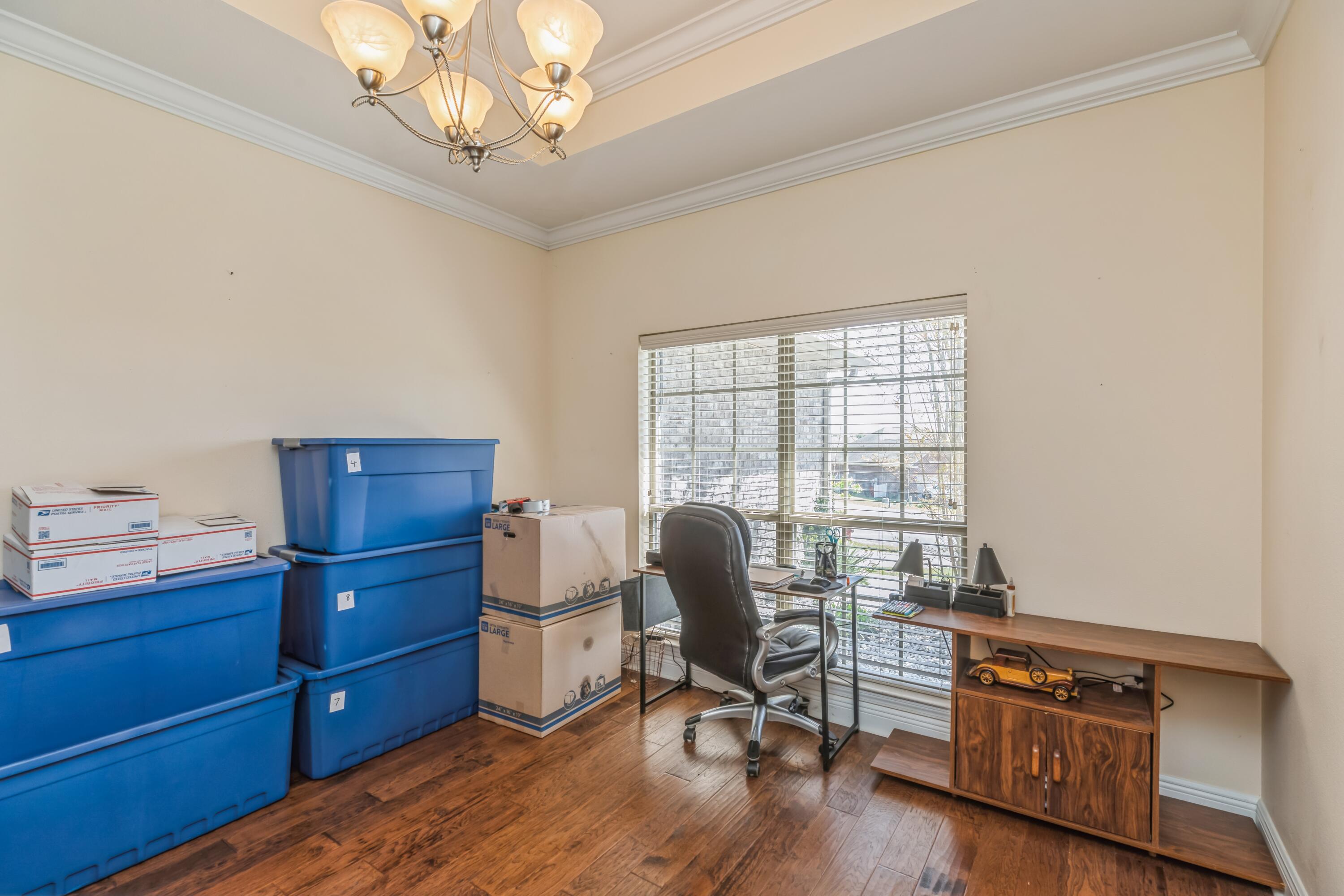 609 Rowan Circle Crestview, FL 32536 - Photo 7 of 37 a view of a workspace with furniture and a window