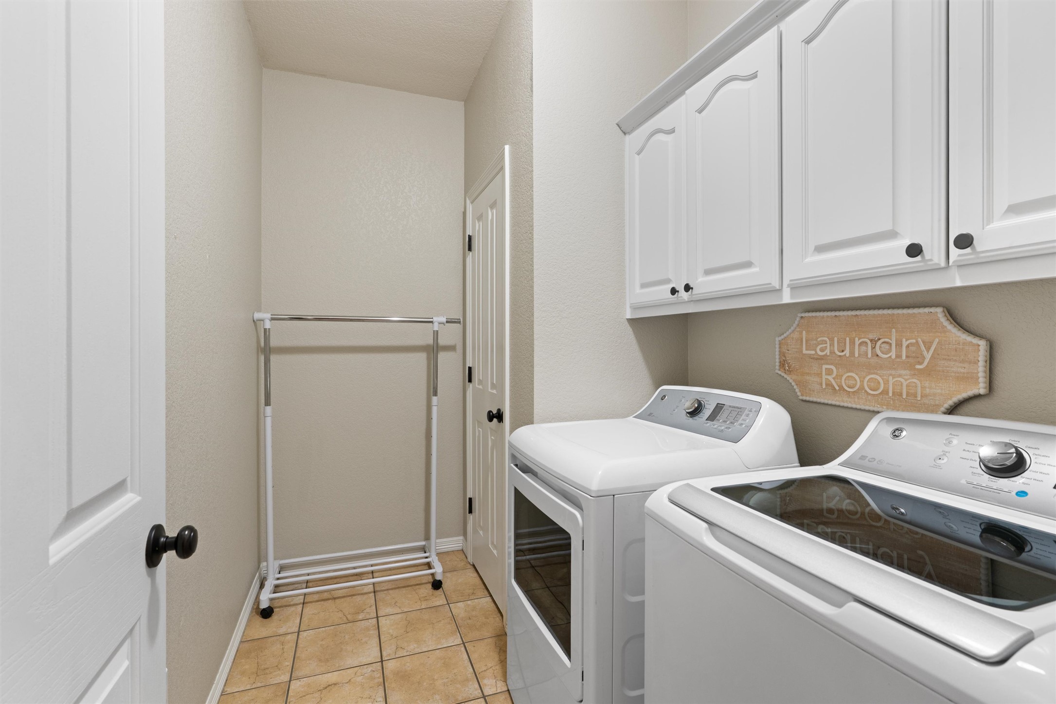 223 East Ridgewood Road Georgetown, TX 78633 - Photo 37 of 40 Functional laundry room in the main home with ample cabinetry for storage