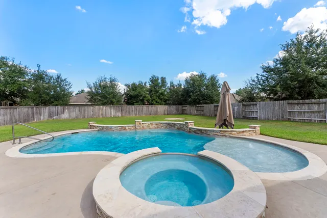 a view of a swimming pool with a sitting area