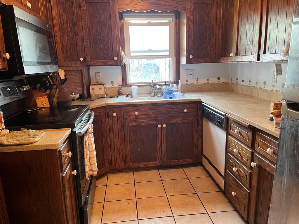 164 Nagel Road Oil City, PA 16301 - Photo 12 of 37 a kitchen with stainless steel appliances granite countertop a sink stove and cabinets