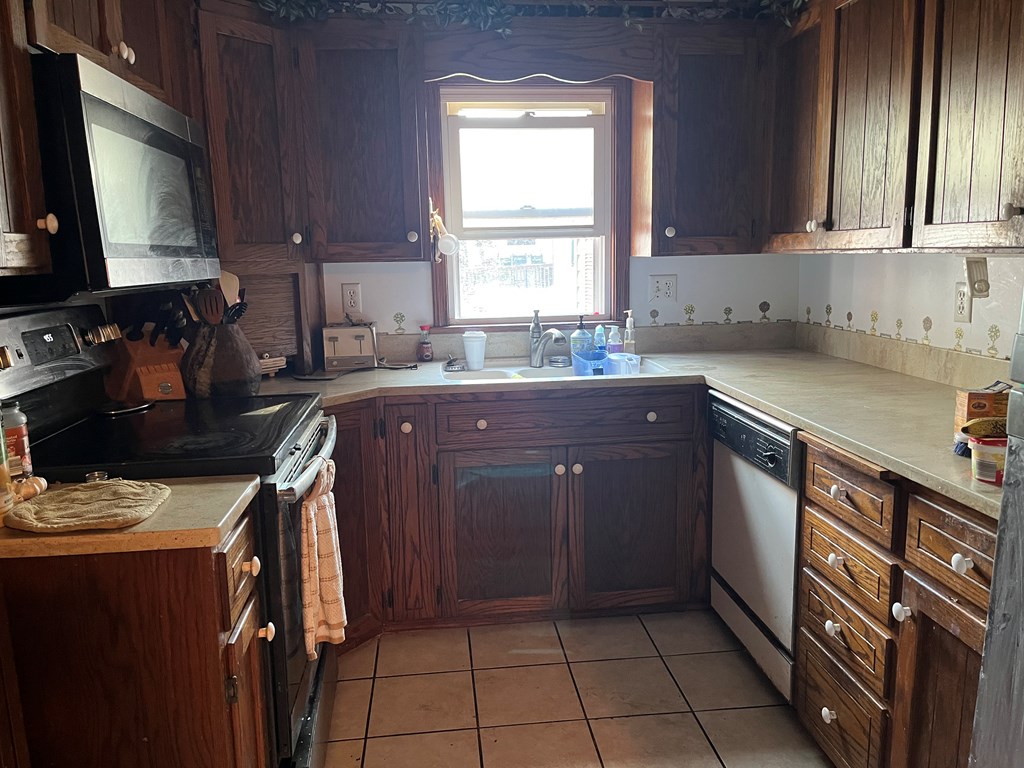 164 Nagel Road Oil City, PA 16301 - Photo 13 of 37 a kitchen with a sink stove and cabinets