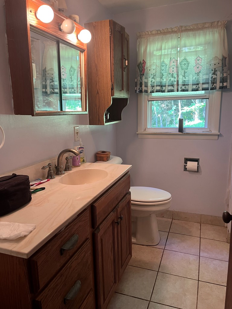 164 Nagel Road Oil City, PA 16301 - Photo 18 of 37 a bathroom with a sink a toilet and a mirror