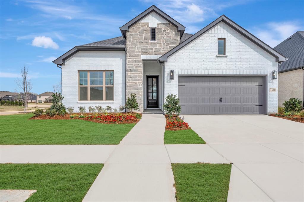 1603 Terry Street Van Alstyne, TX 75495 - Photo 1 of 1 a front view of a house with a yard and garage