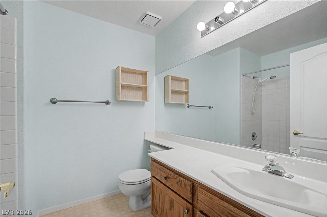 2243 Rugged Mesa Drive Laughlin, NV 89029 - Photo 23 of 32 Bright, practical bathroom with a functional vanity and shower, ready for daily routines.