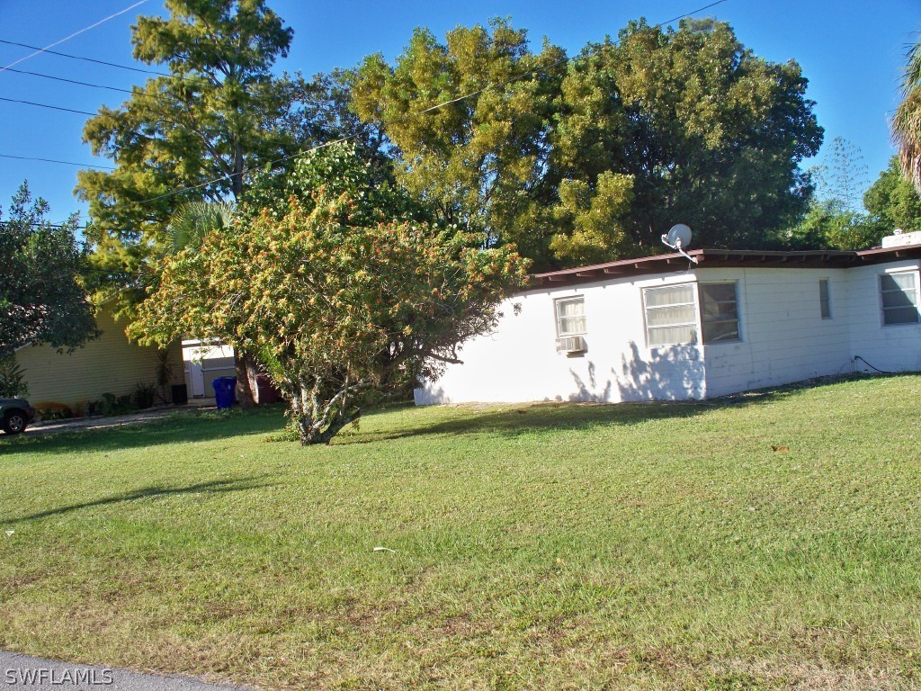 1866 Coronado Road Fort Myers, FL 33901 - Photo 3 of 5 a view of a backyard with large trees