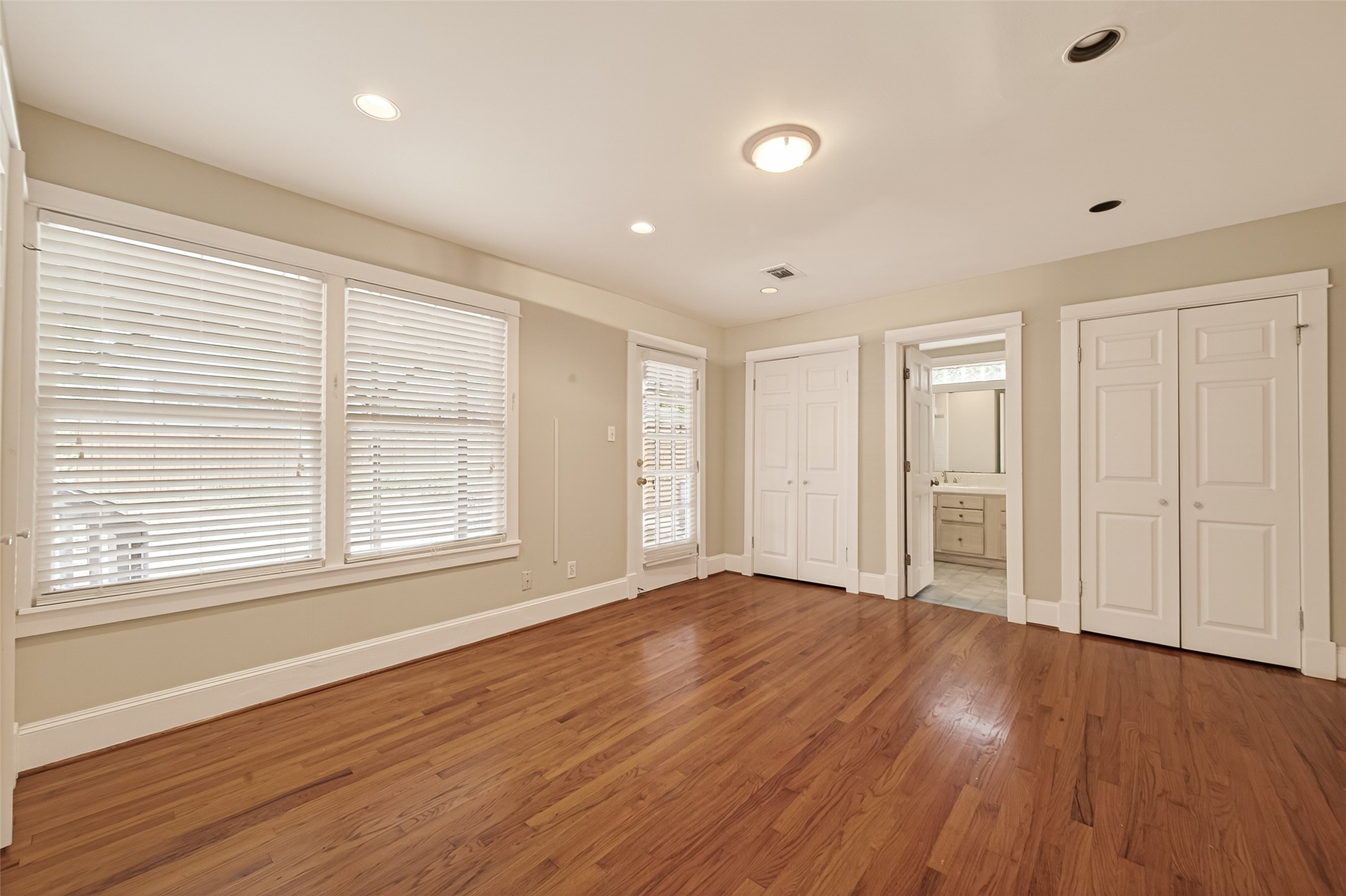 1807 Crocker Street, Unit A Houston, TX 77006 - Photo 17 of 37 This primary bedroom is at the rear of the house and looks out to the back patio. Double closets shown here...