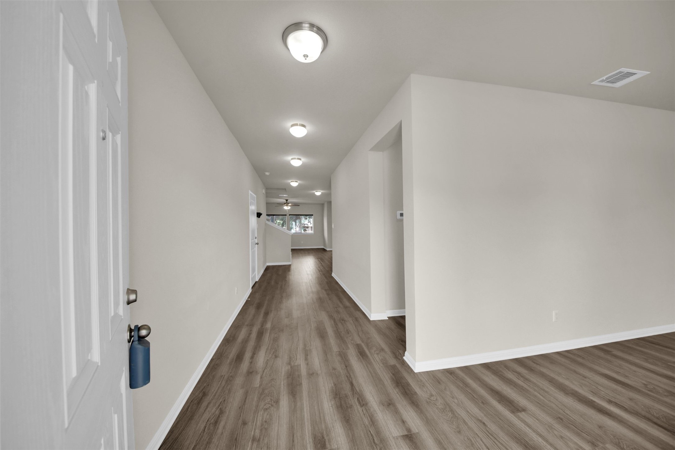 1829 Chickasaw Run Leander, TX 78641 - Photo 2 of 40 a view of a hallway with wooden floor