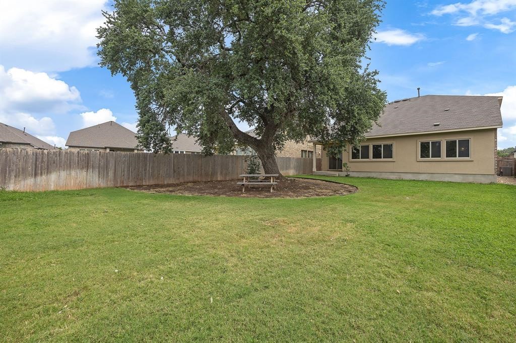 1829 Chickasaw Run Leander, TX 78641 - Photo 38 of 40 a backyard of a house with lots of green space