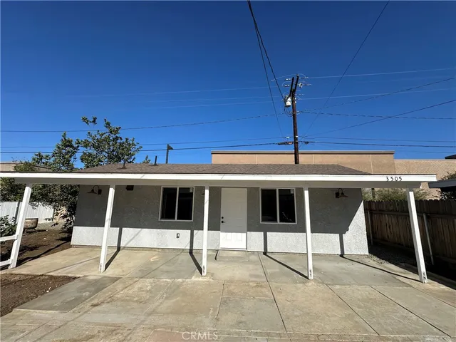 a balcony with table and chairs