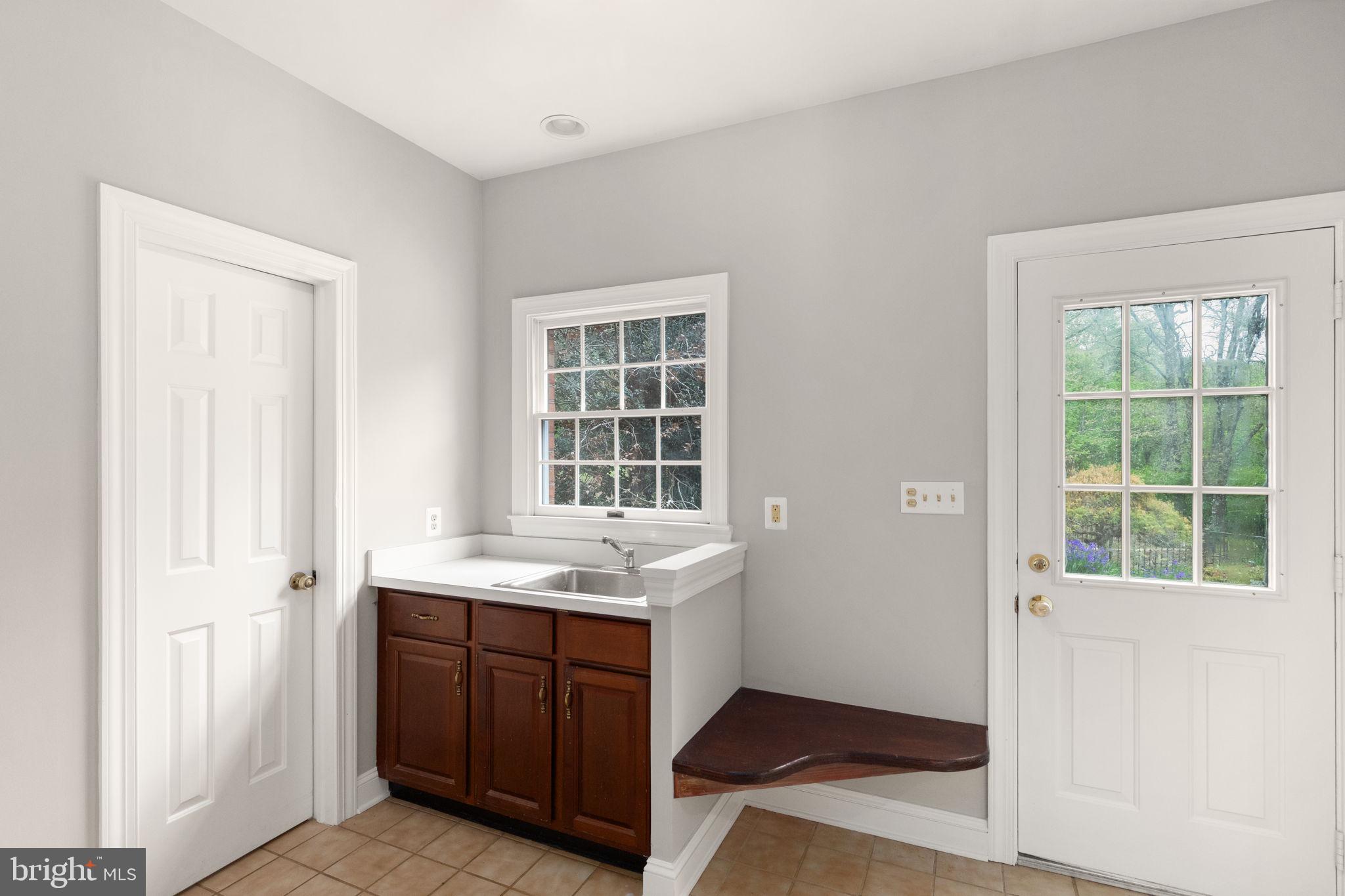 14613 Philpot Road Phoenix, MD 21131 - Photo 9 of 69 Mud Room Leading to Outside Cooking Area