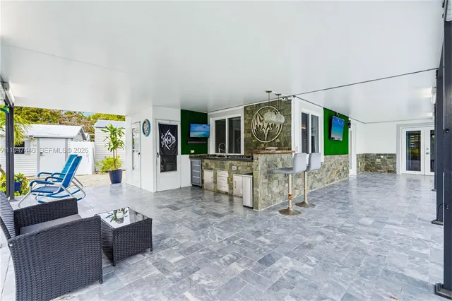a kitchen with stainless steel appliances granite countertop a stove and cabinets