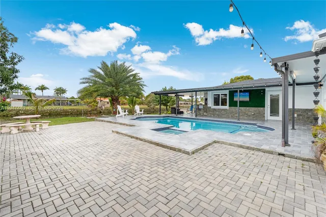 a view of a house with a swimming pool