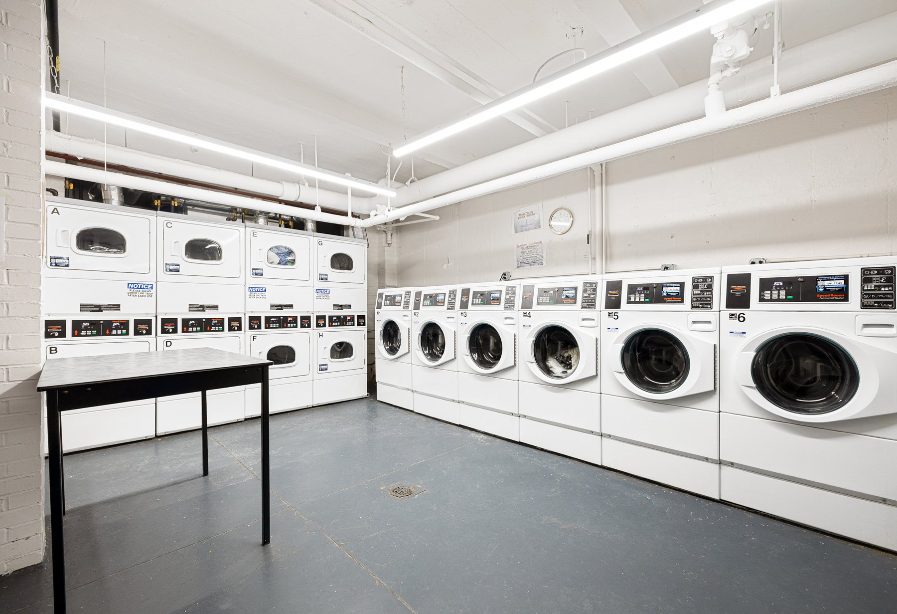 123 East 37th Street, Unit 10E Manhattan, NY 10016 - Photo 15 of 18 a utility room with washer and dryer