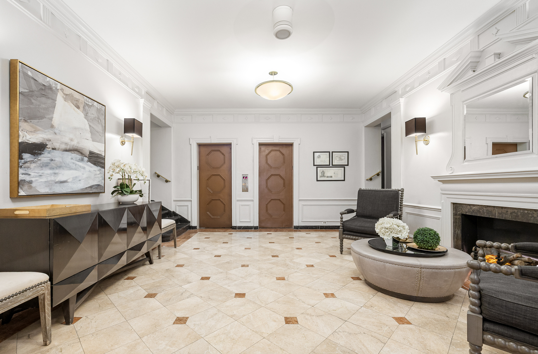 123 East 37th Street, Unit 10E Manhattan, NY 10016 - Photo 16 of 18 a living room with furniture a fireplace and a painting on the wall
