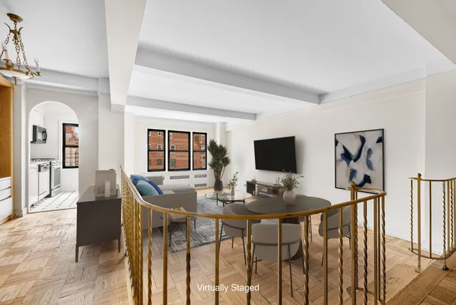a view of a hallway with wooden floor and entryway