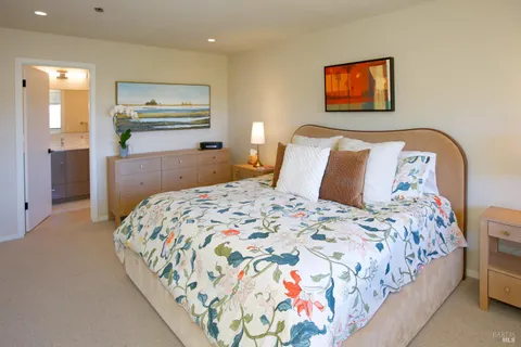 a bedroom with bed and window
