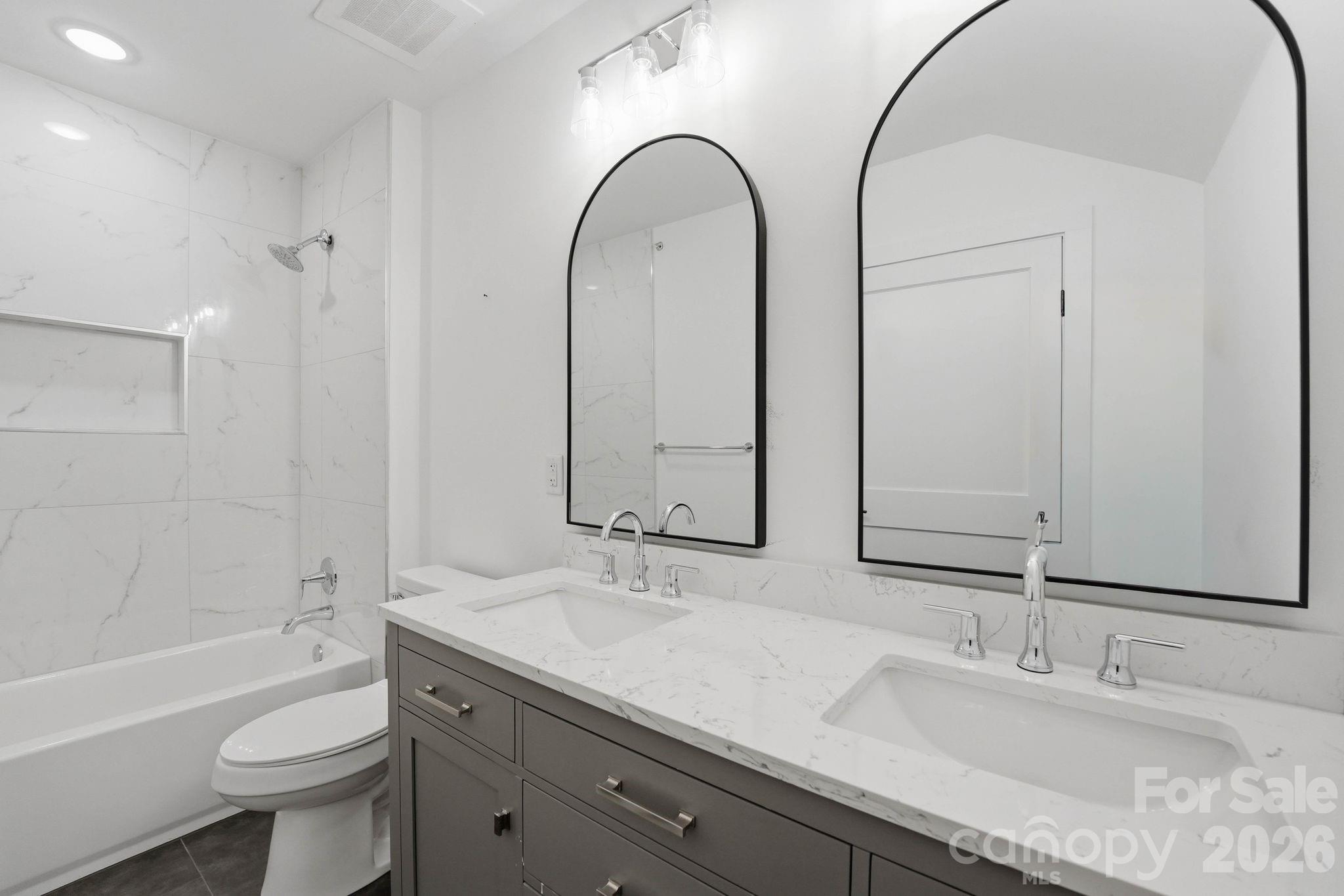 201 Grandin Road, Unit 6 Charlotte, NC 28208 - Photo 18 of 45 a bathroom with a double vanity sink and a mirror