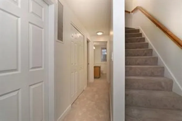 a view of a hallway with staircase