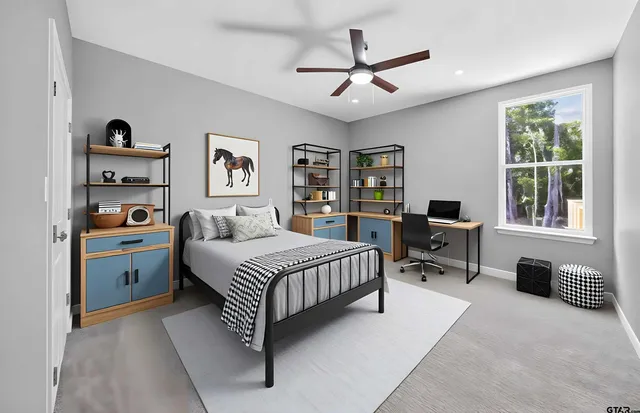 a spacious bedroom with a bed a dresser and a window