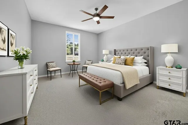 a bedroom with bed and a chandelier