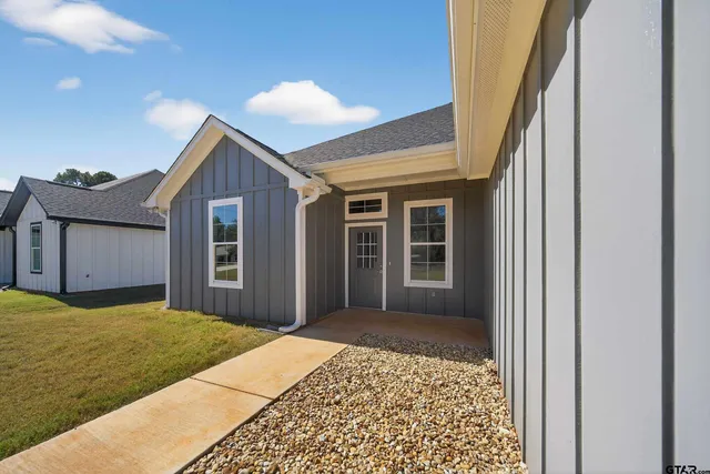 a house view with a backyard space