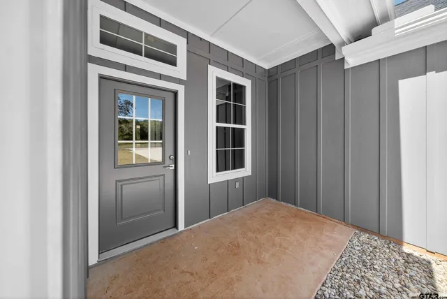 a view of a hallway with windows