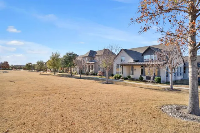 a view of a town with large trees