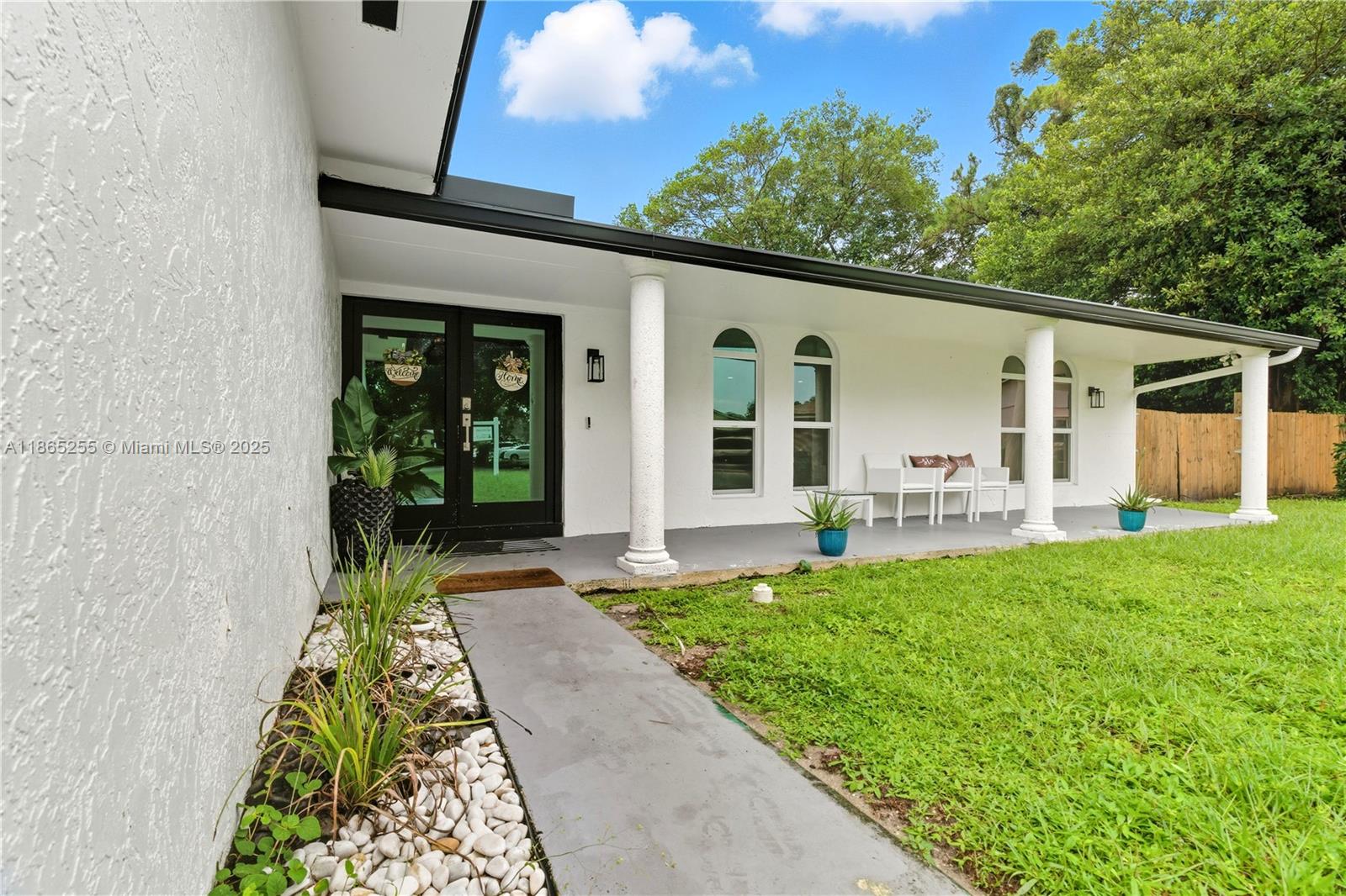 a front view of a house with garden