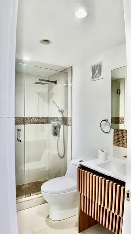 a bathroom with a bathtub and shower