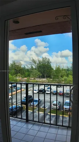 a view of a refrigerator in wooden floor