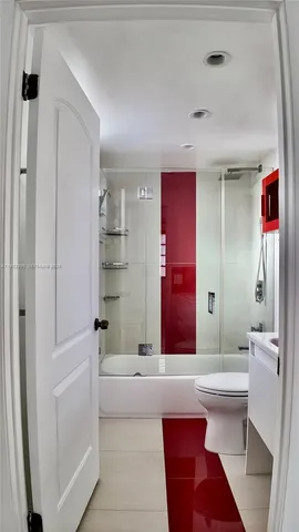 a bathroom with a bathtub and a sink