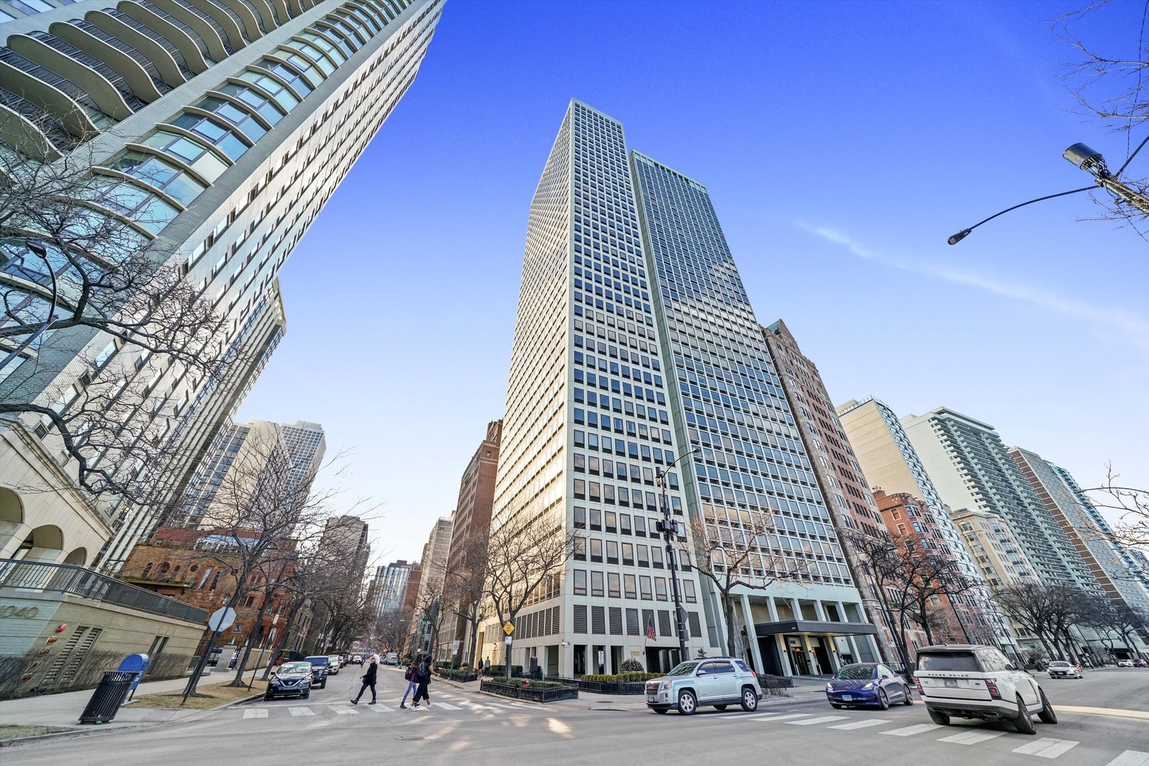 1100 North Lake Shore Drive, Unit 23C Chicago, IL 60611 - Photo 1 of 17 a view of a tall building next to a road