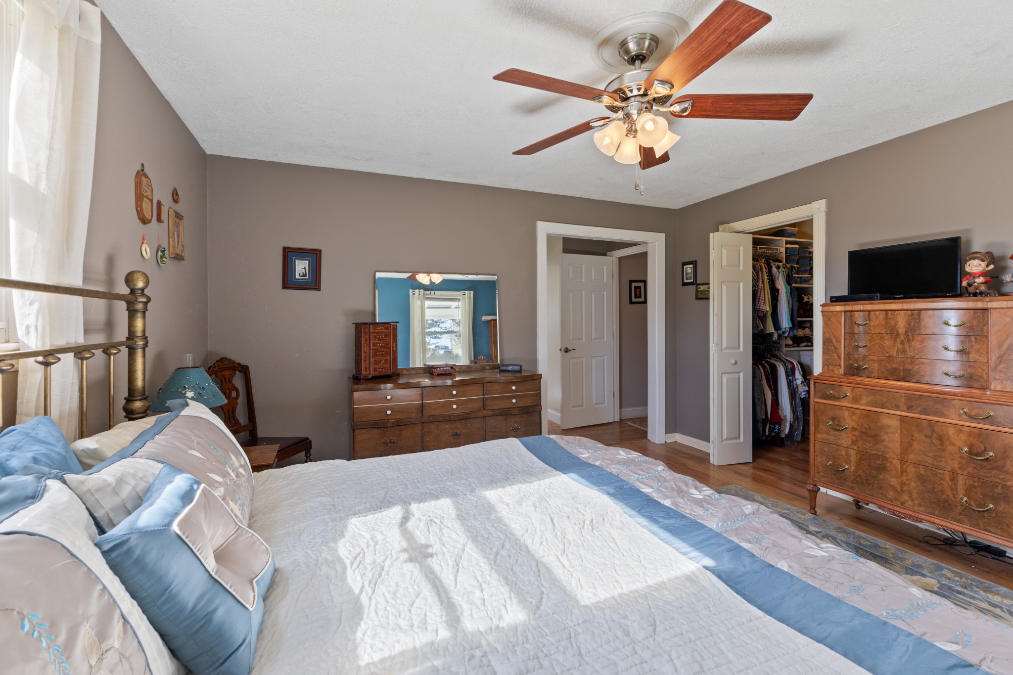2760 Cave Springs Road Springfield, TN 37172 - Photo 12 of 74 a bedroom with a bed and a chandelier