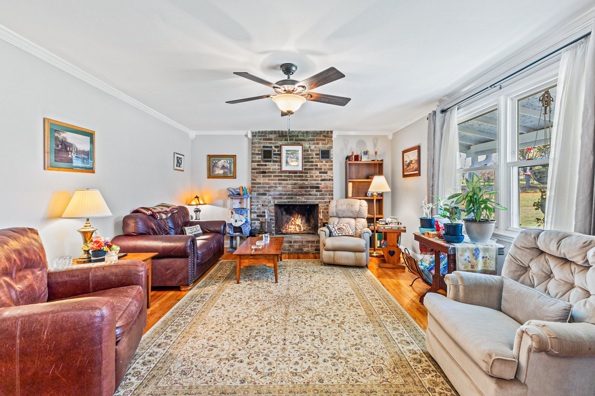 2760 Cave Springs Road Springfield, TN 37172 - Photo 2 of 74 a living room with furniture a fireplace and a large window