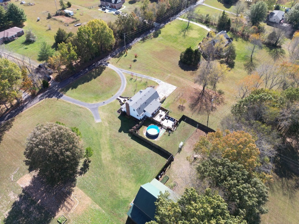 2760 Cave Springs Road Springfield, TN 37172 - Photo 55 of 74 an aerial view of a house with a yard and trees