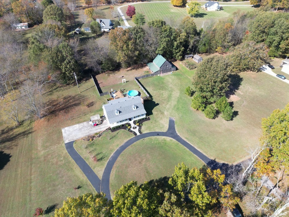 2760 Cave Springs Road Springfield, TN 37172 - Photo 60 of 74 an aerial view of a house with a yard swimming pool and outdoor seating