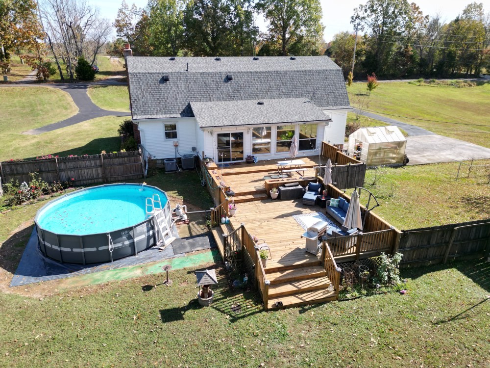 2760 Cave Springs Road Springfield, TN 37172 - Photo 70 of 74 an aerial view of a house with swimming pool and large trees