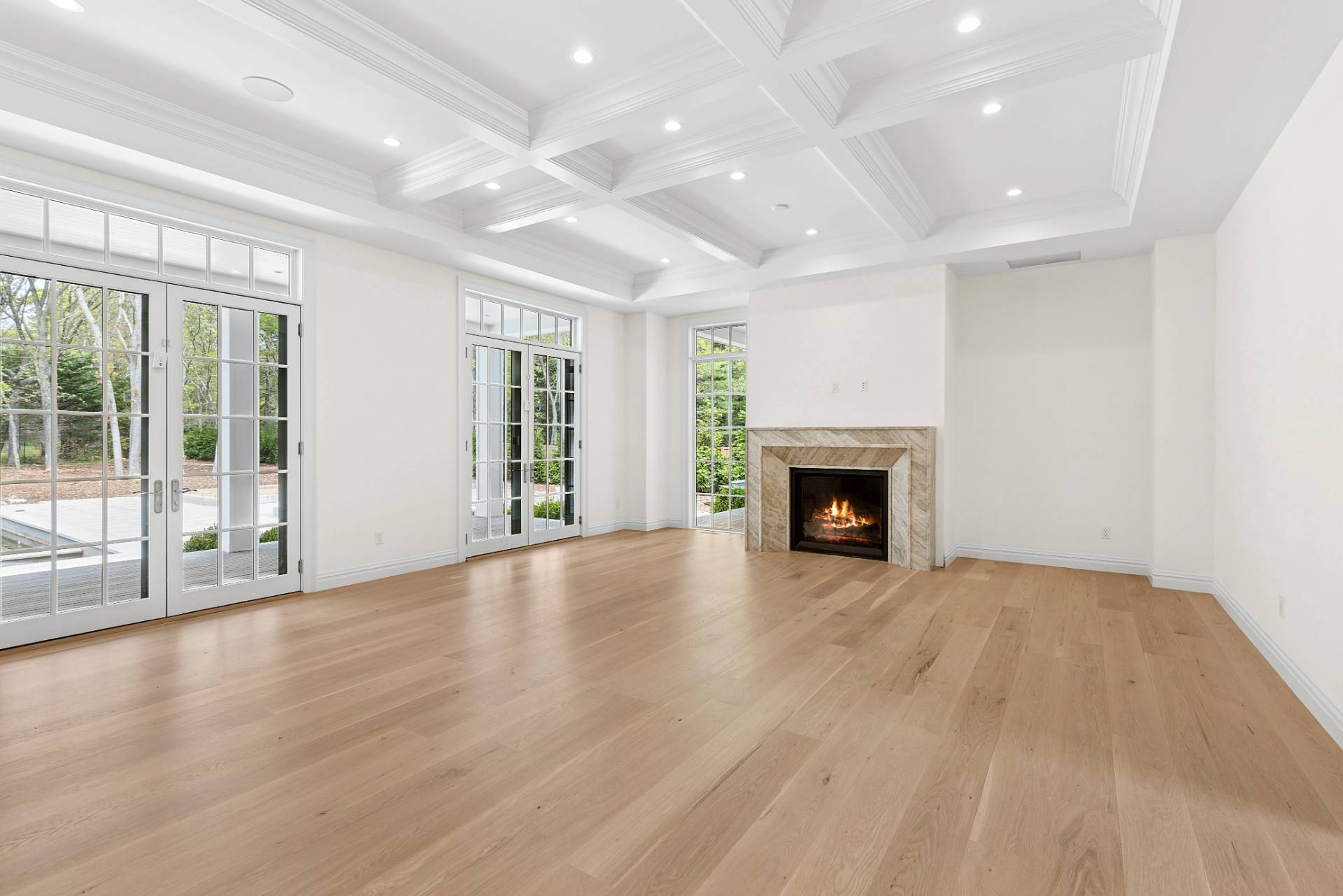 73 Wainscott Stone Road Wainscott, NY 11975 - Photo 14 of 27 a view of an empty room with wooden floor and a window