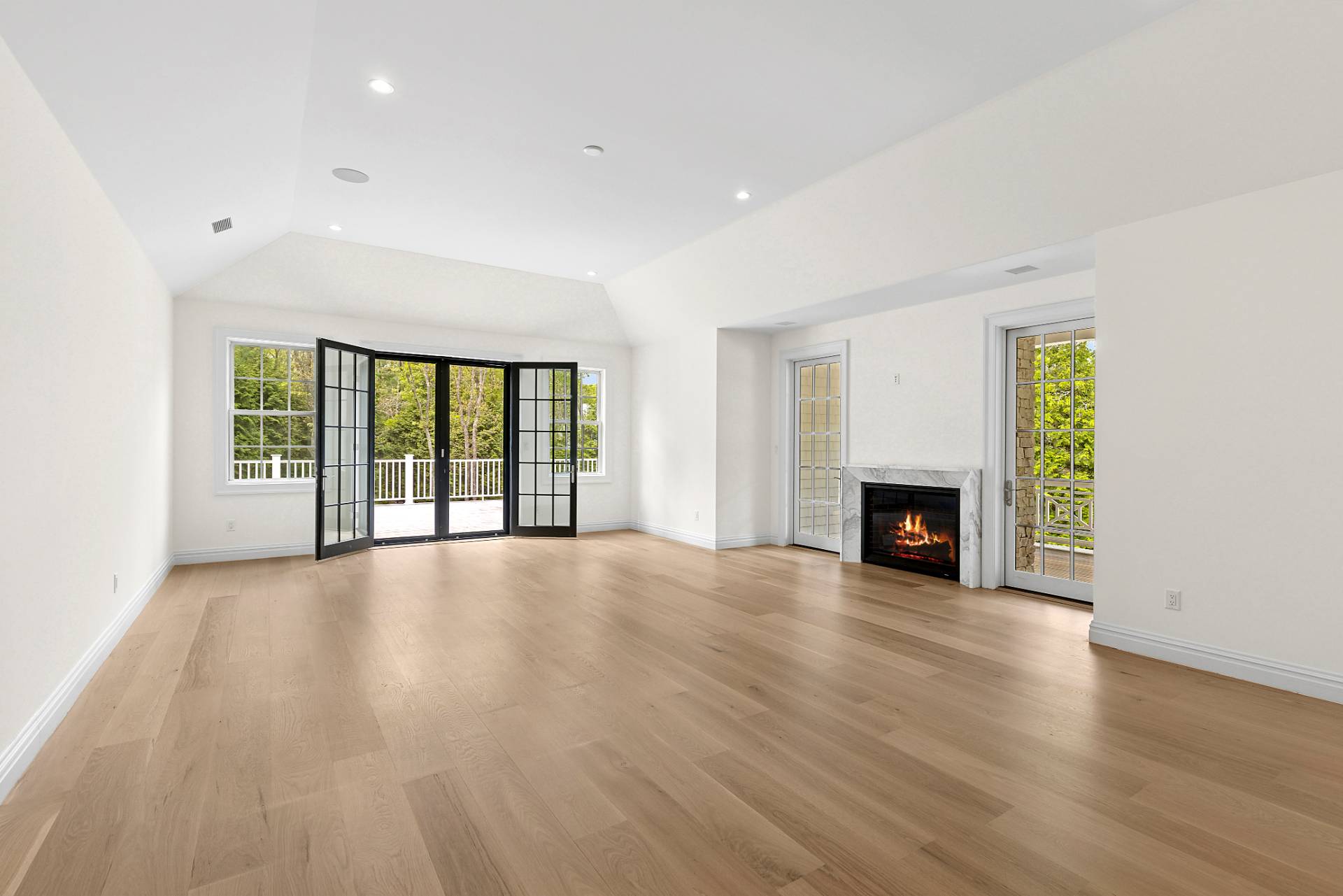 73 Wainscott Stone Road Wainscott, NY 11975 - Photo 15 of 27 a view of an empty room with wooden floor and a window