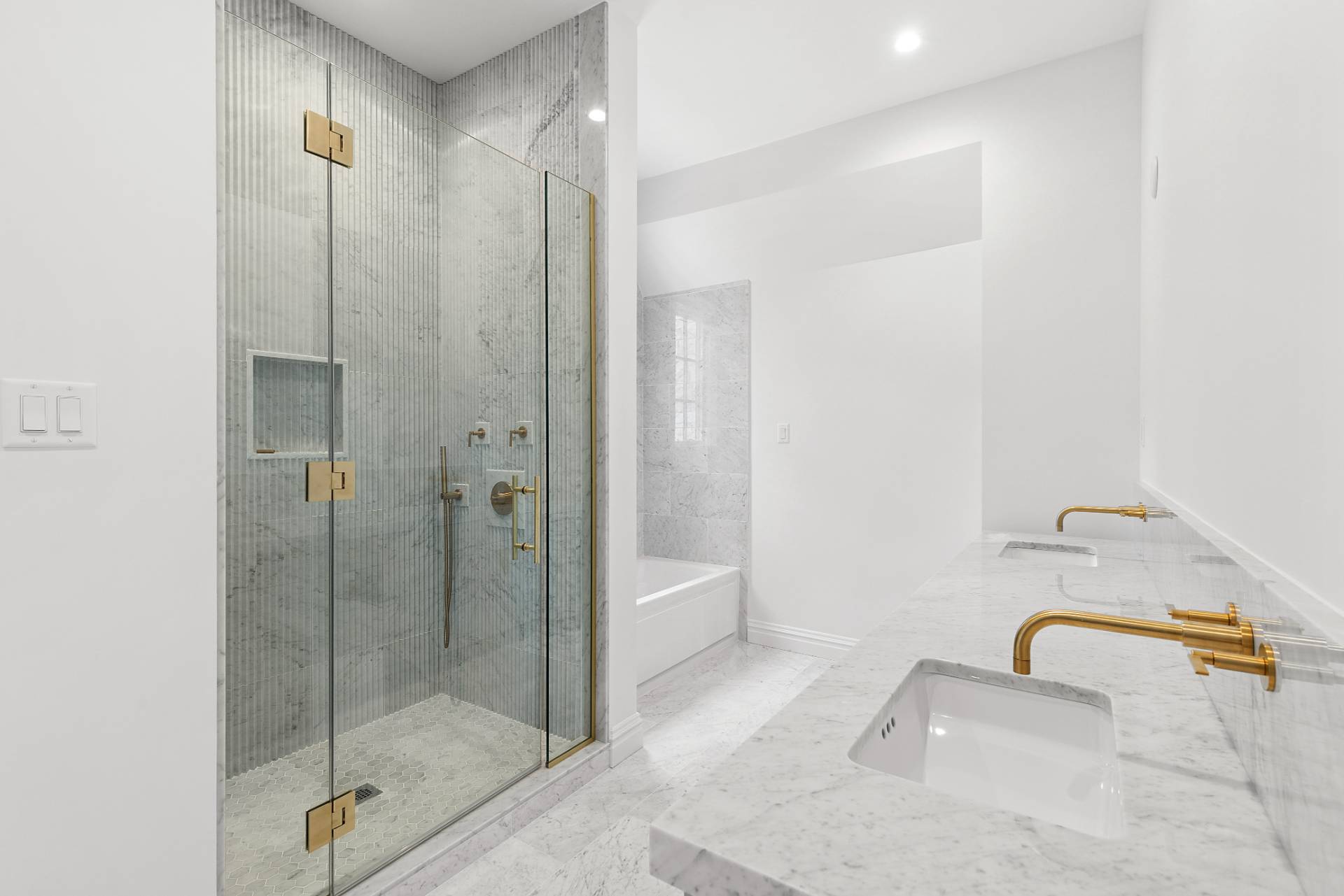 73 Wainscott Stone Road Wainscott, NY 11975 - Photo 19 of 27 a bathroom with a sink and shower