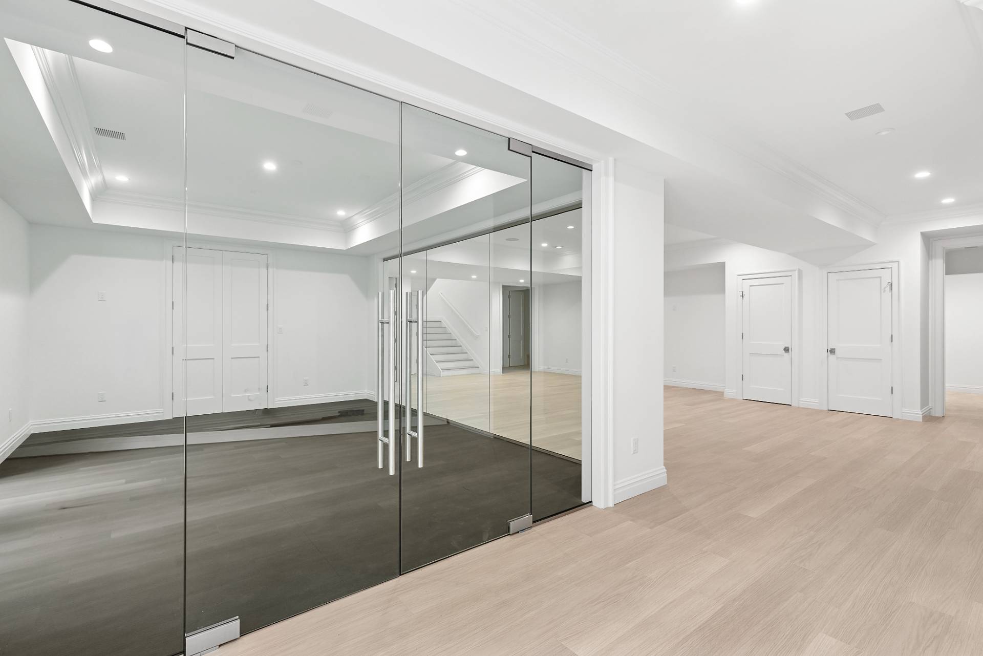 73 Wainscott Stone Road Wainscott, NY 11975 - Photo 21 of 27 a view of an empty room with wooden floor
