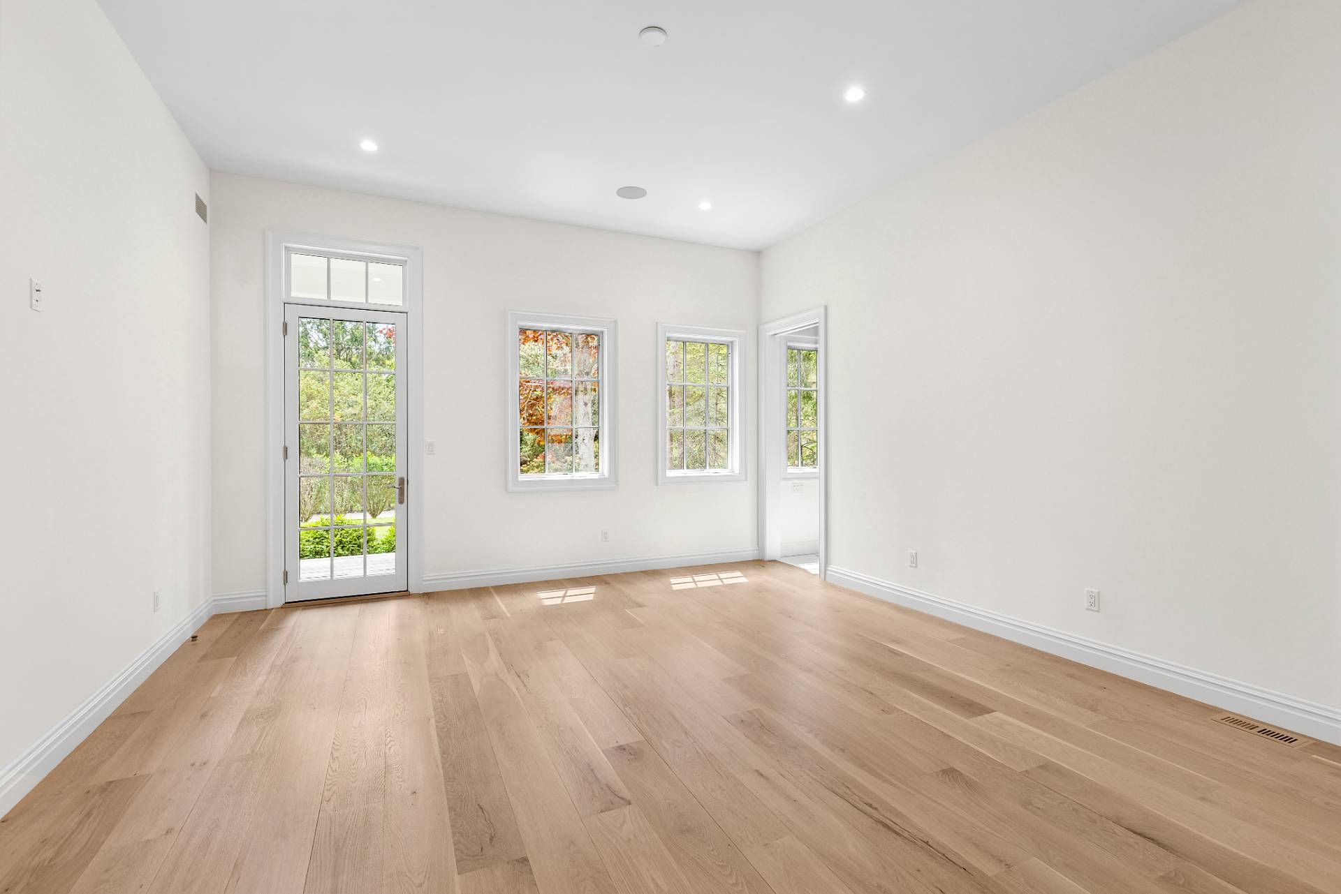 73 Wainscott Stone Road Wainscott, NY 11975 - Photo 27 of 27 a view of an empty room with wooden floor and a window