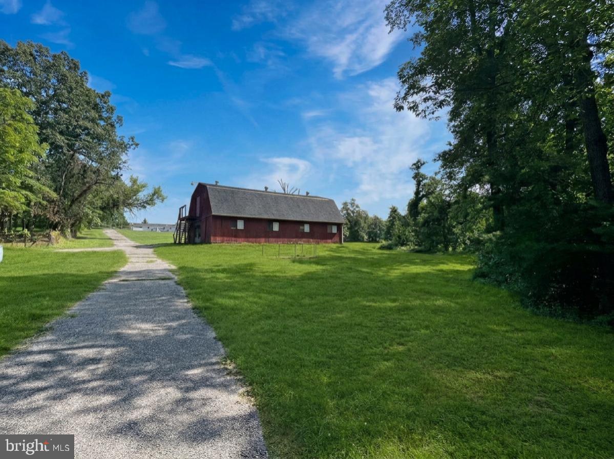 1271 Sleepy Hollow Road Severn, MD 21144 - Photo 7 of 16 Charming barn nestled in lush greenery.