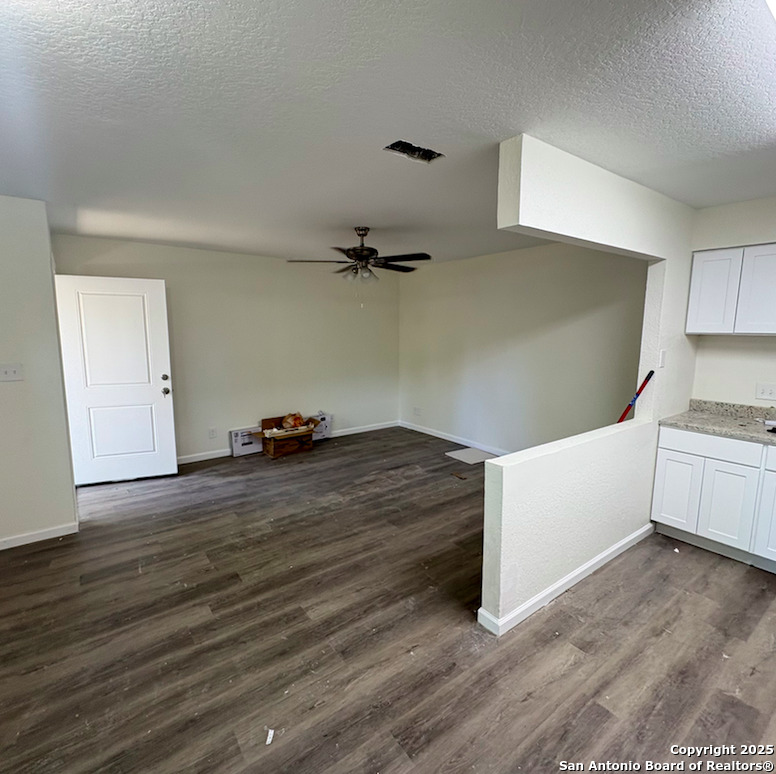 428 North Vaughan Avenue, Unit 3 Seguin, TX 78155 - Photo 5 of 7 a view of a kitchen with wooden floor