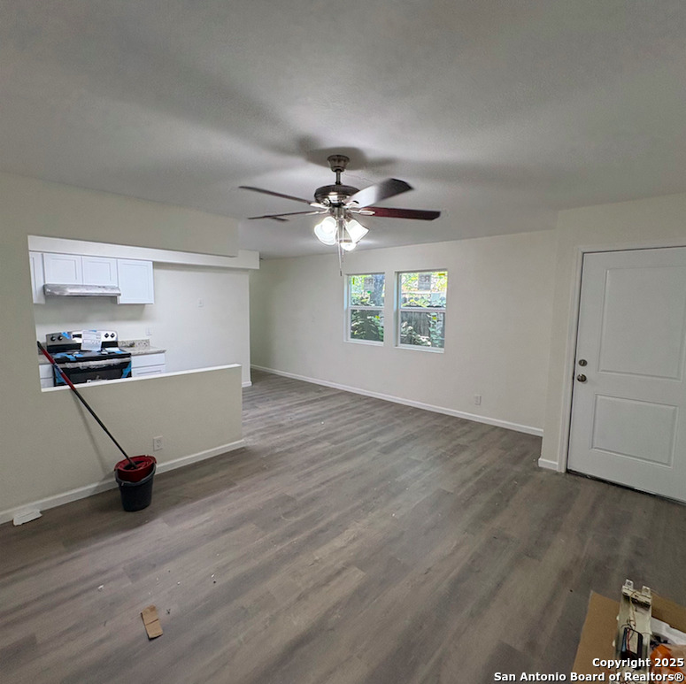 428 North Vaughan Avenue, Unit 3 Seguin, TX 78155 - Photo 7 of 7 a view of an empty room with a window