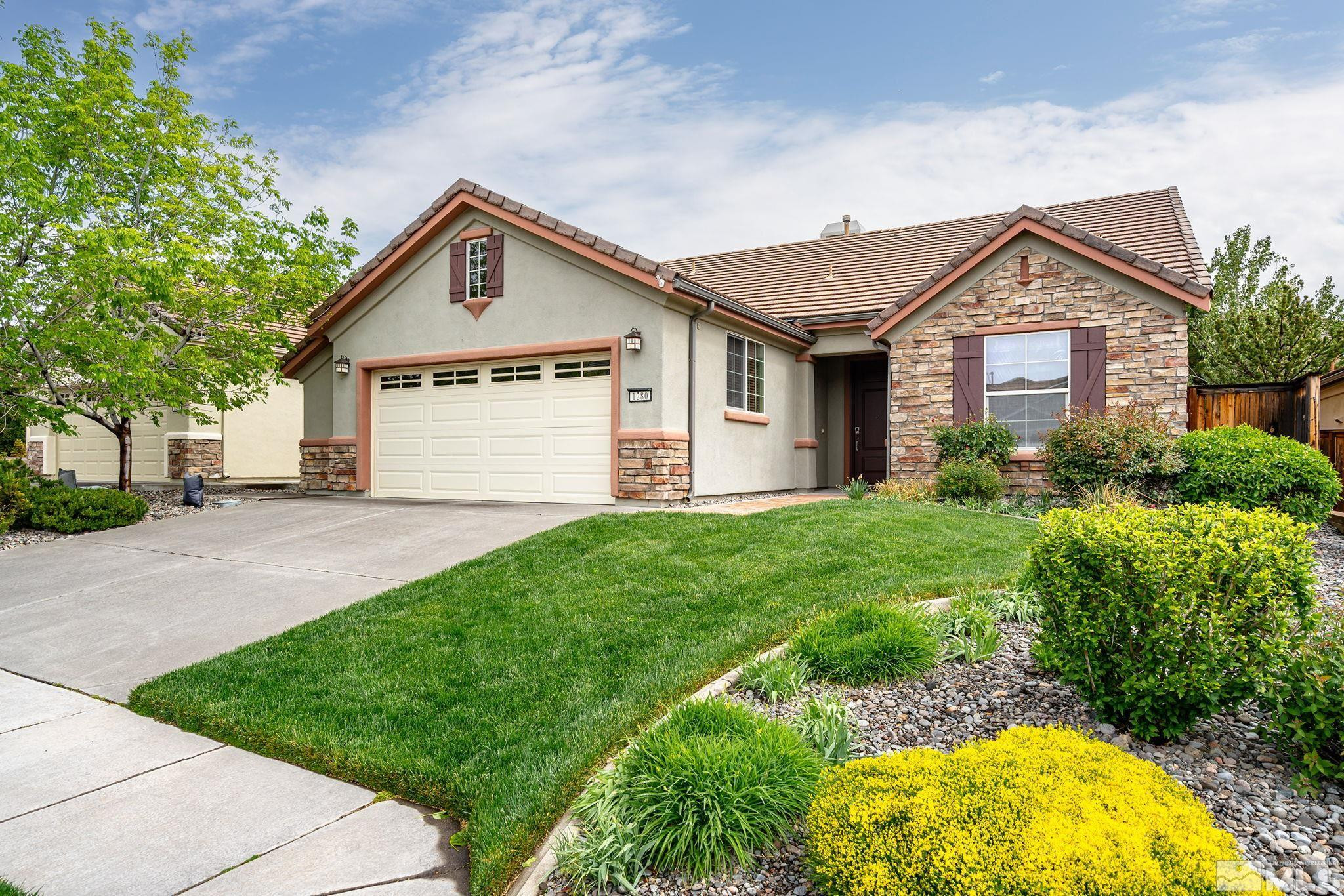 1280 Meridian Ranch Drive Reno, NV 89523 - Photo 1 of 41 a view of a house with yard and plants