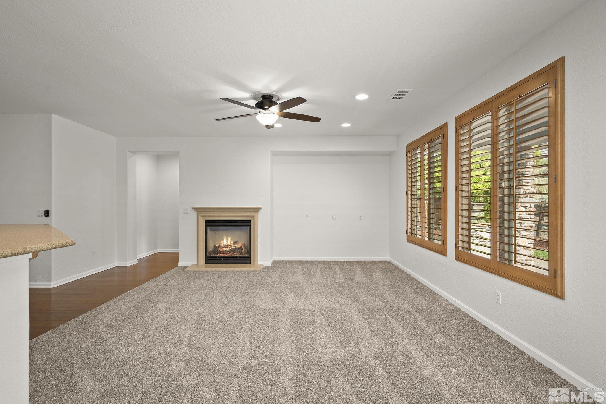 1280 Meridian Ranch Drive Reno, NV 89523 - Photo 12 of 41 a view of an empty room with a window and a fireplace
