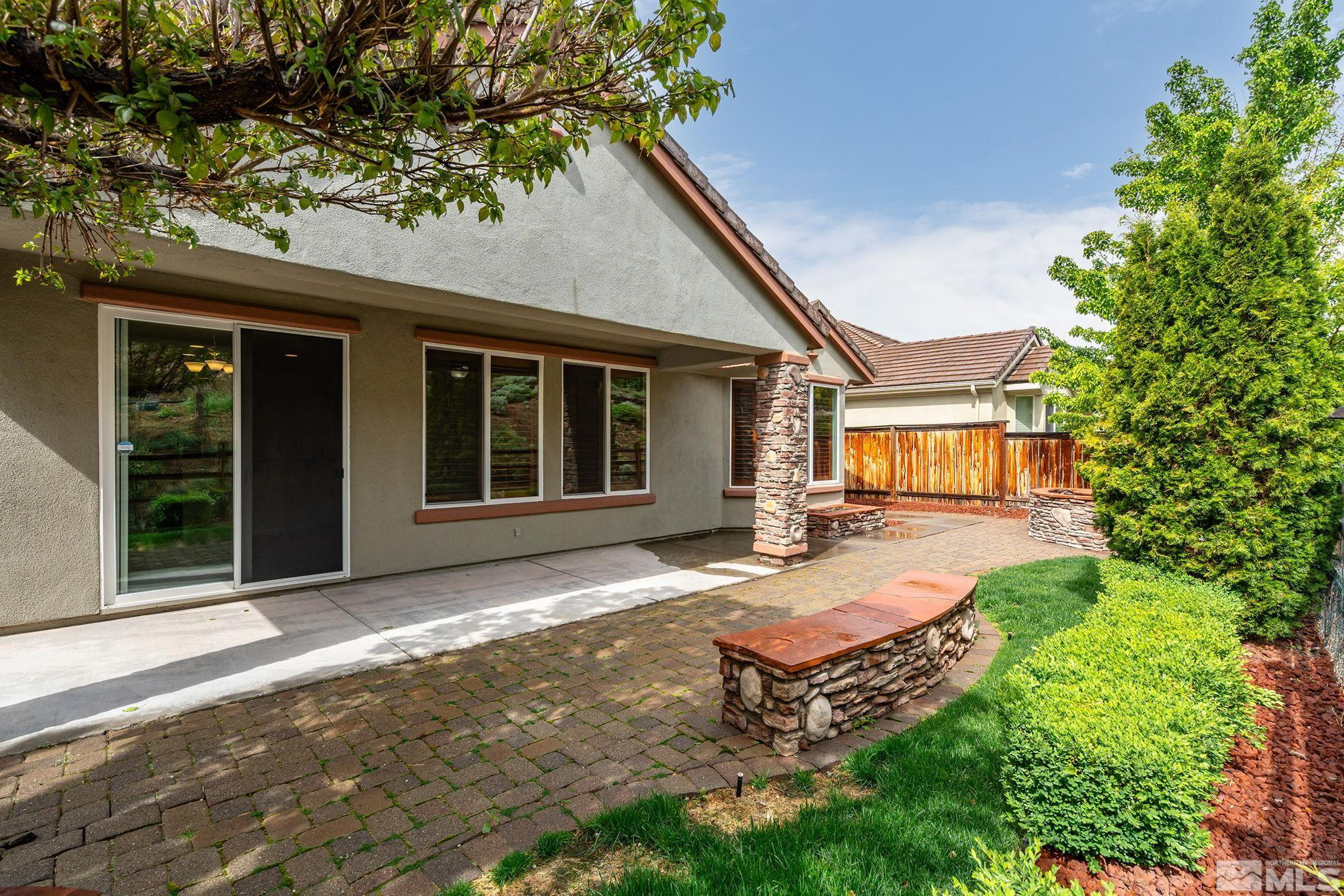 1280 Meridian Ranch Drive Reno, NV 89523 - Photo 27 of 41 a front view of a house with a yard outdoor seating and garage