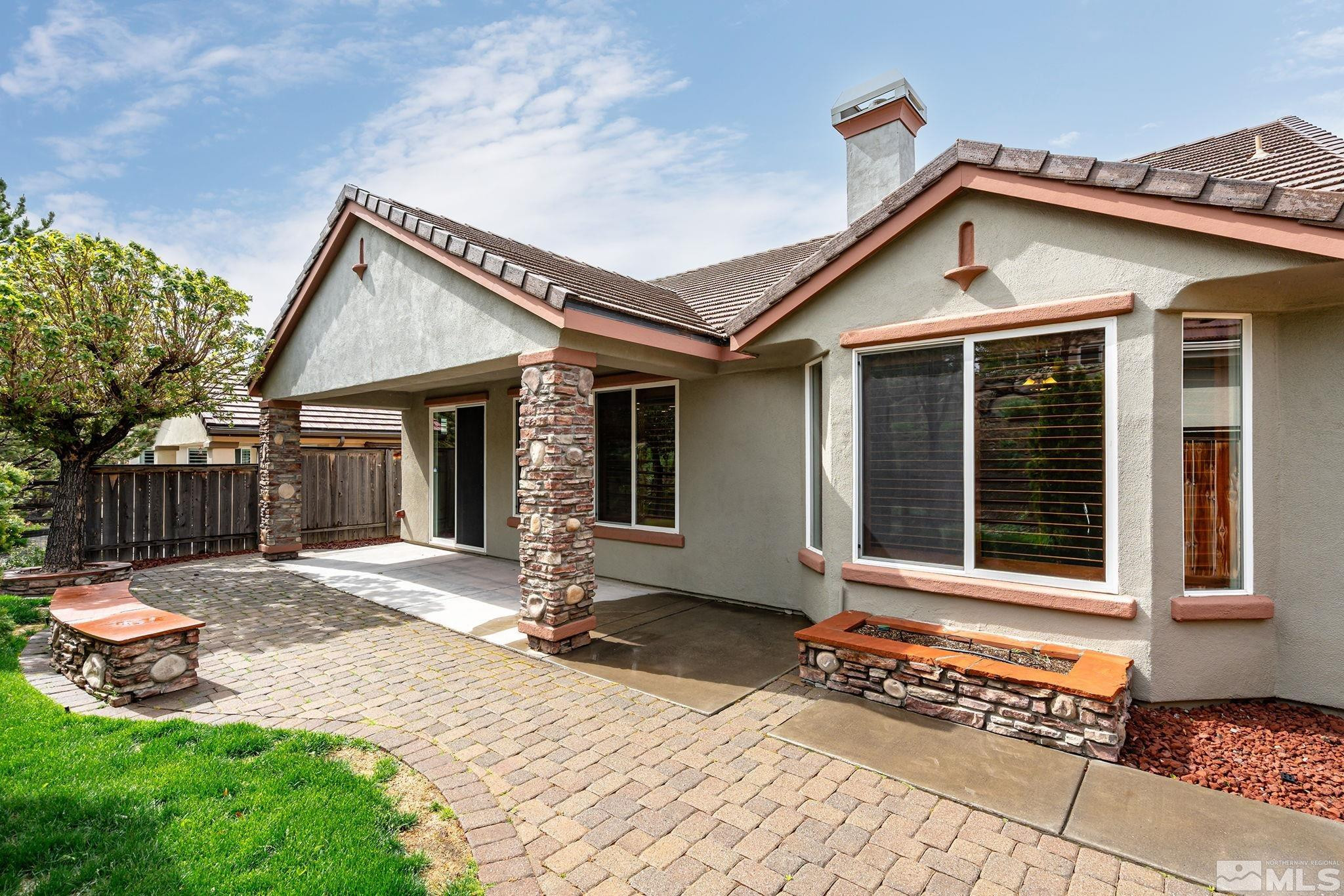 1280 Meridian Ranch Drive Reno, NV 89523 - Photo 28 of 41 a front view of a house with a yard outdoor seating and garage